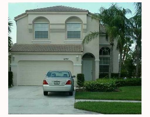 6797 Ashburn Ridge Lake Lake Worth, FL 33467 - Photo 1 of 4 a car parked in front of a house