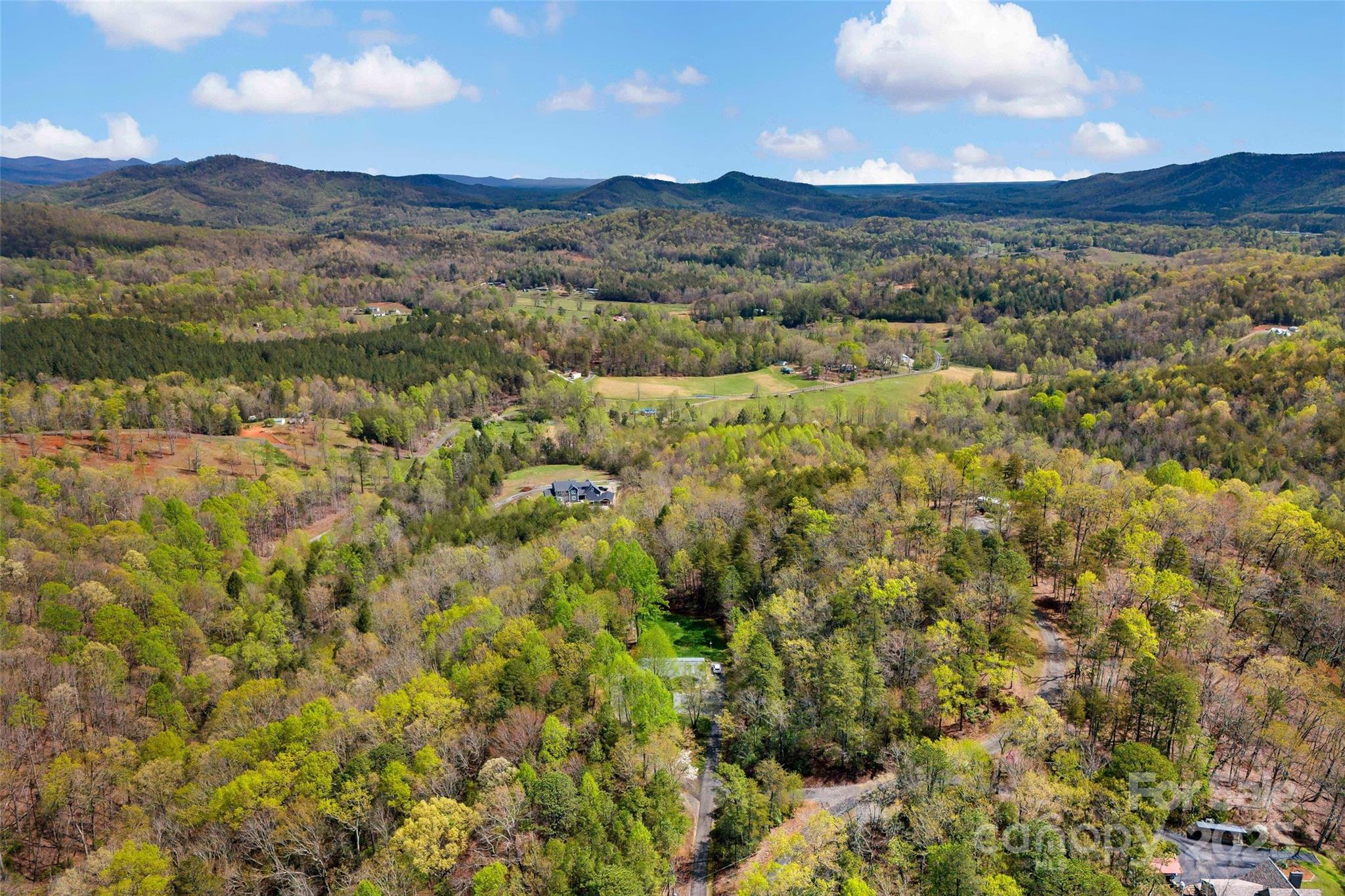 690 Hidden Acres Drive Marion, NC 28752 - Photo 12 of 12 a view of a city with mountains in the background