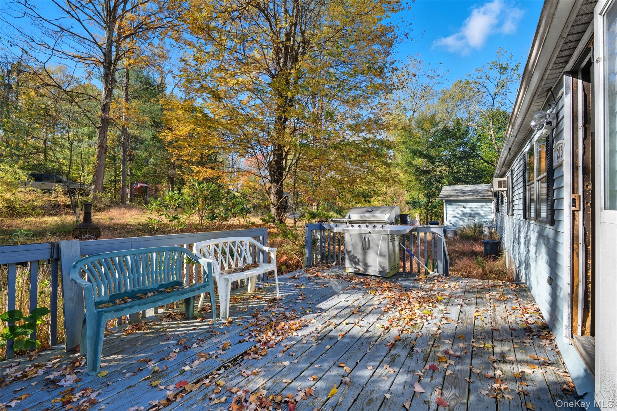 215 Old Rte 32 Highland Mills, NY 10930 - Photo 13 of 34 a view of a patio with table and chairs and wooden floor