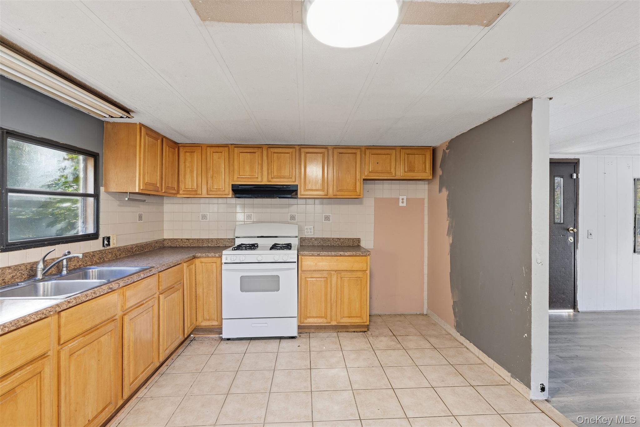 215 Old Rte 32 Highland Mills, NY 10930 - Photo 15 of 34 a kitchen with a stove sink and cabinets