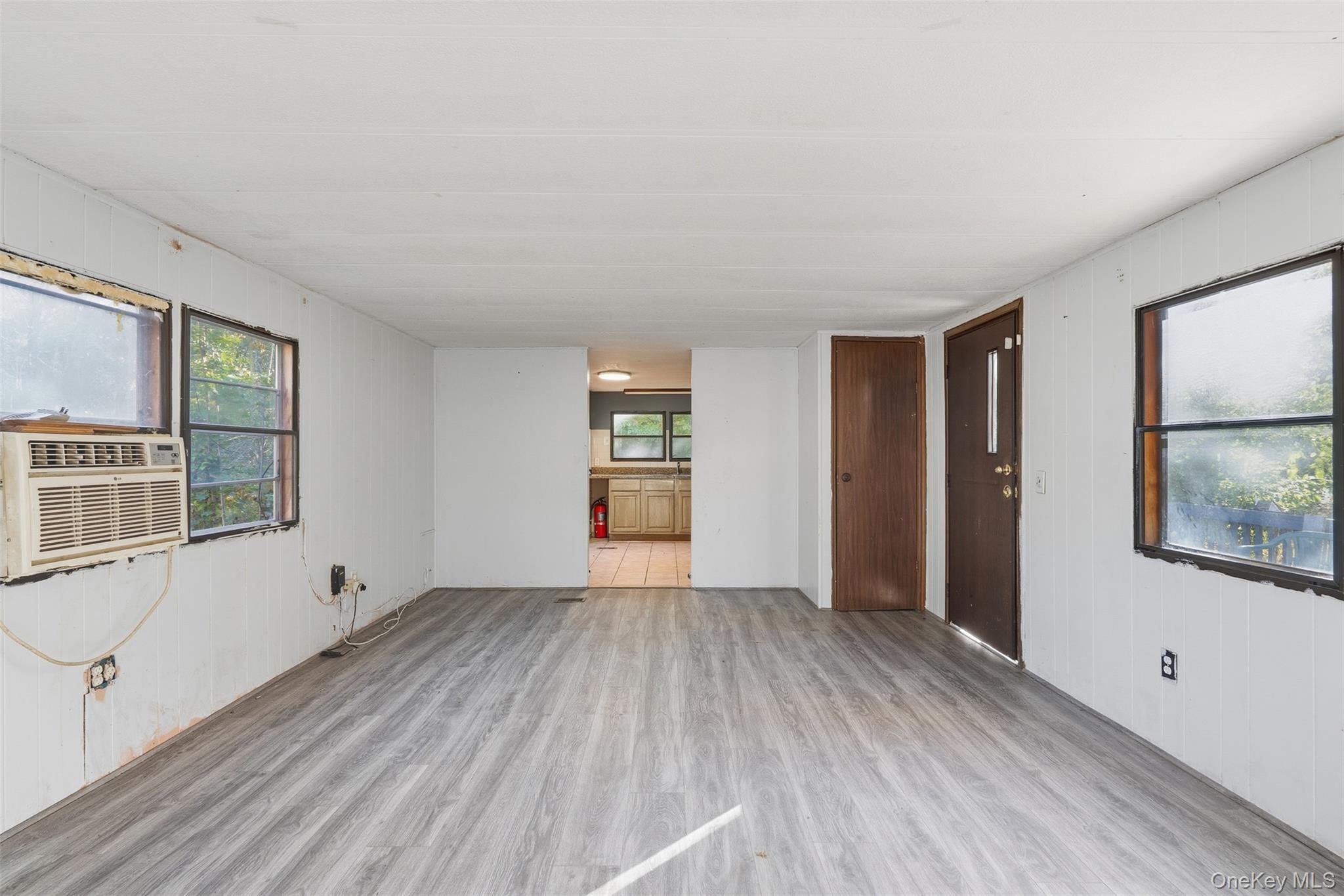 215 Old Rte 32 Highland Mills, NY 10930 - Photo 17 of 34 a view of an empty room with a window and wooden floor