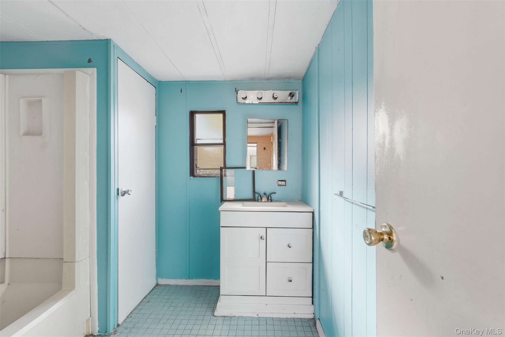 215 Old Rte 32 Highland Mills, NY 10930 - Photo 22 of 34 a bathroom with a sink a toilet and mirror