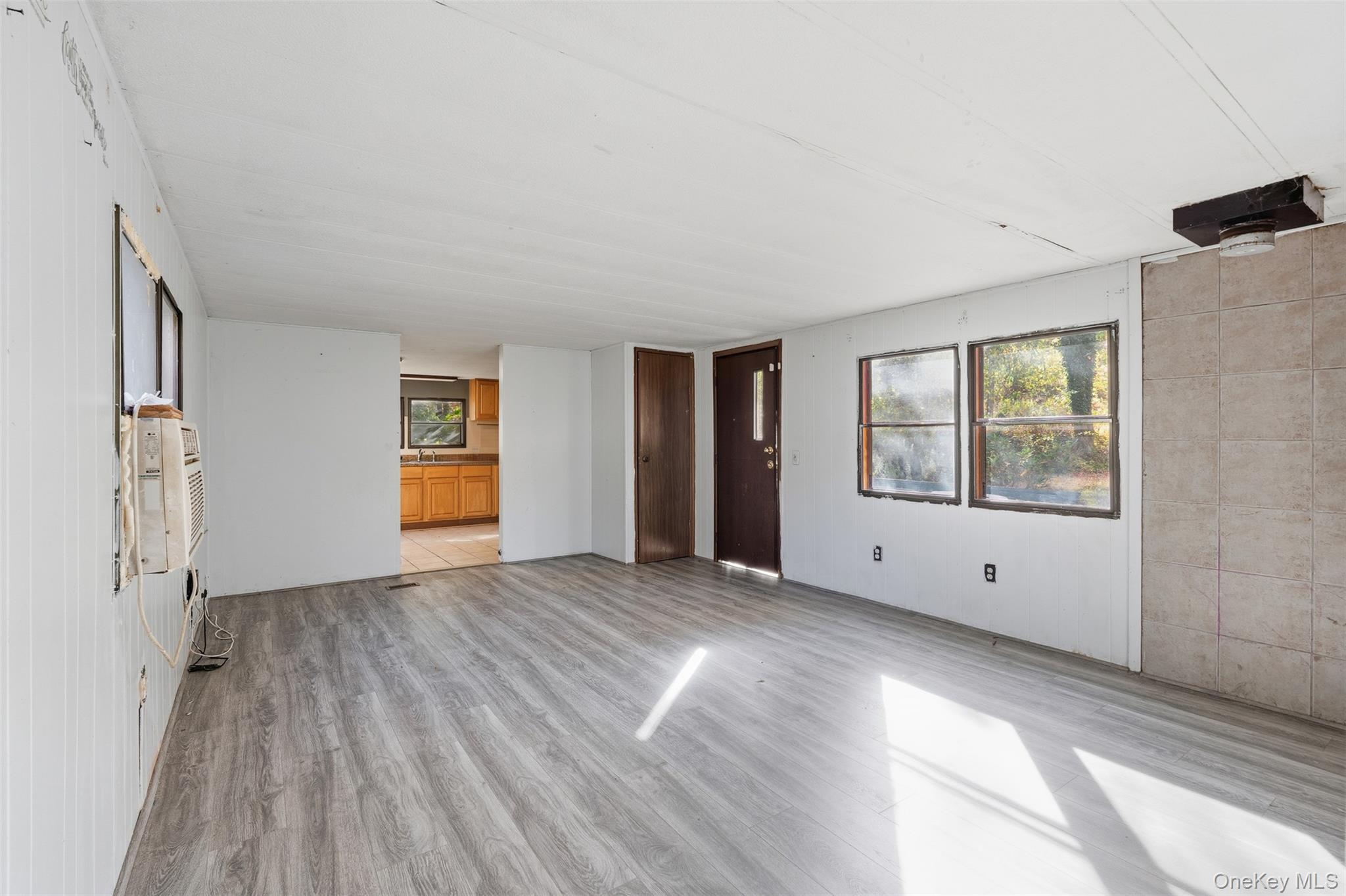 215 Old Rte 32 Highland Mills, NY 10930 - Photo 27 of 34 a view of an empty room with window and wooden floor
