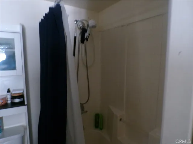 a bathroom with a sink and a chair