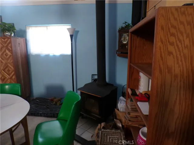 a kitchen with granite countertop cabinets and black appliances