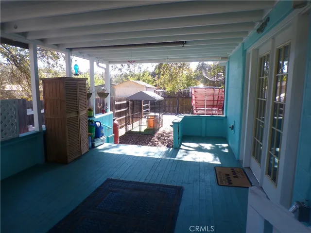 a view of a living room and a floor to ceiling window