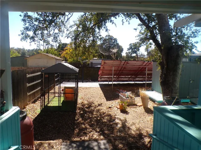 a view of a backyard of the house