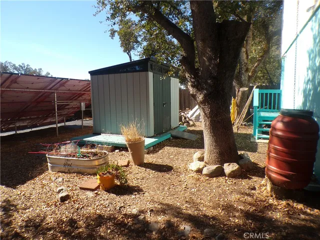 a backyard of a house with barbeque oven