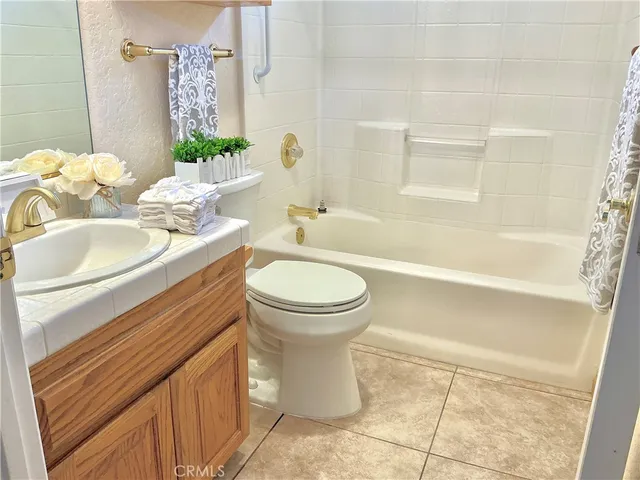 a bathroom with a sink a toilet and a bathtub