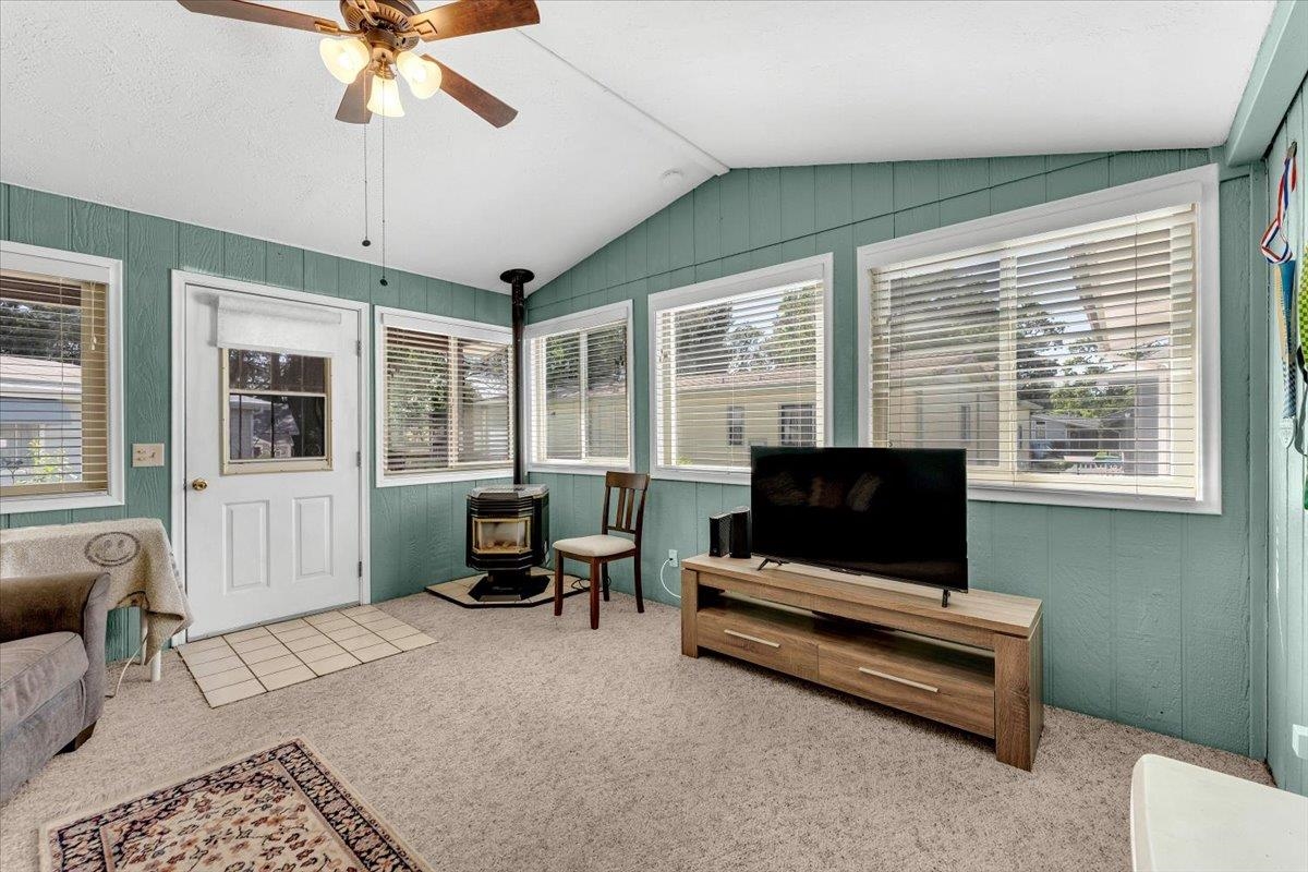 350 Gilmore Road Red Bluff, CA 96080 - Photo 12 of 27 a living room with furniture windows and a flat screen tv