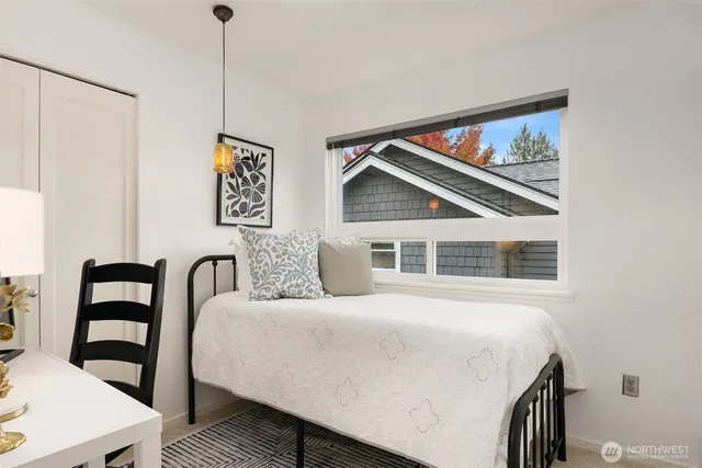 a bedroom with a bed and a table