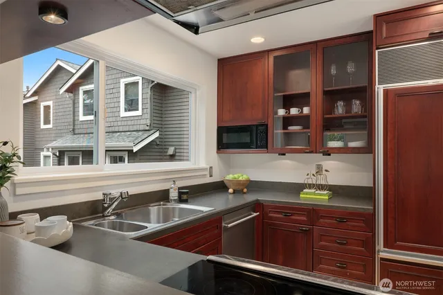 a kitchen with a sink and cabinets