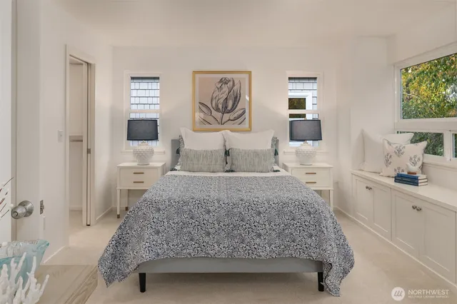 a bedroom with a bed and a couch