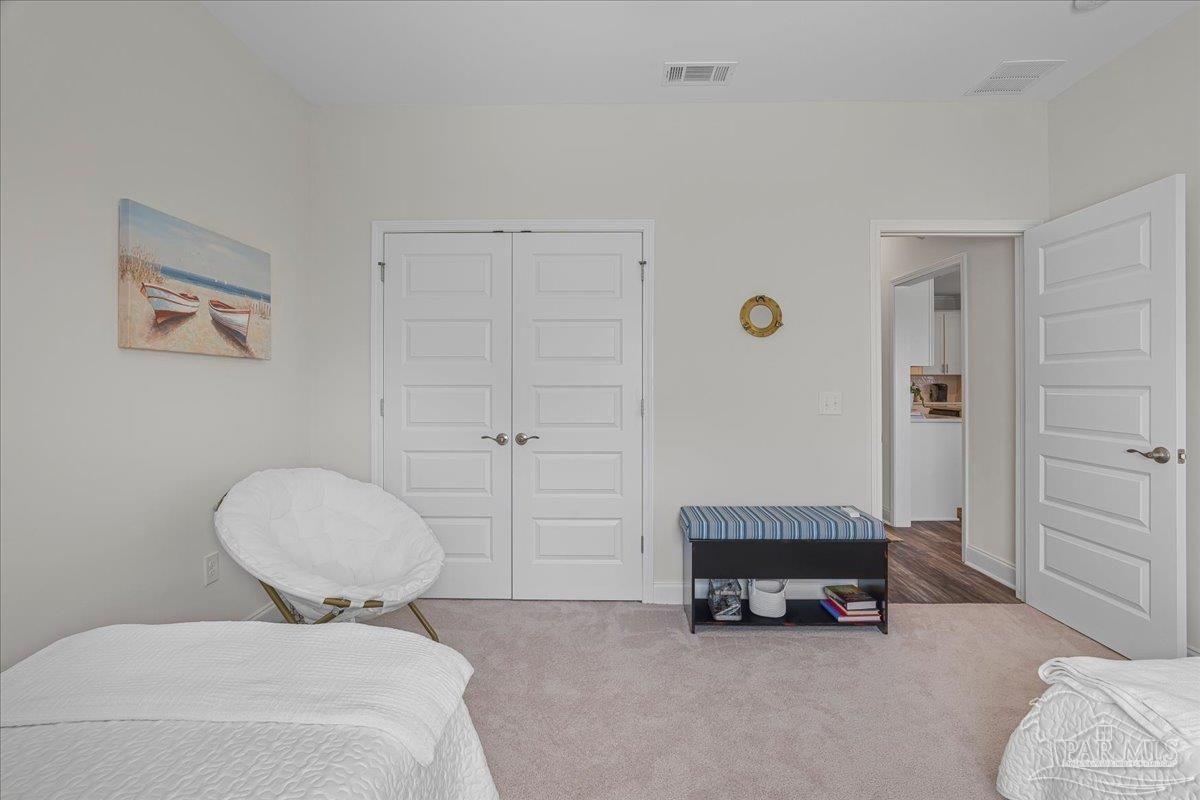 441 Broadleaf Circle Cantonment, FL 32533 - Photo 26 of 42 a bedroom with a bed and a chair