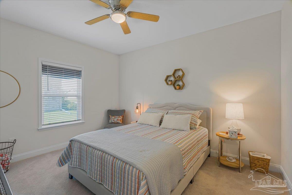 441 Broadleaf Circle Cantonment, FL 32533 - Photo 28 of 42 a bedroom with a bed and a window