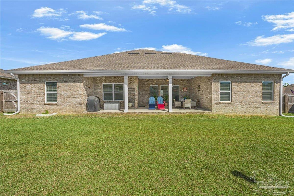 441 Broadleaf Circle Cantonment, FL 32533 - Photo 36 of 42 a view of a house with a backyard