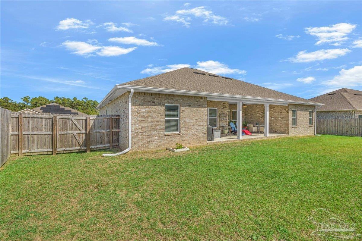 441 Broadleaf Circle Cantonment, FL 32533 - Photo 37 of 42 a front view of a house with a garden