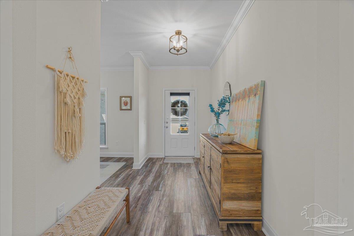 441 Broadleaf Circle Cantonment, FL 32533 - Photo 7 of 42 a view of a room that has a bed and a dresser in it