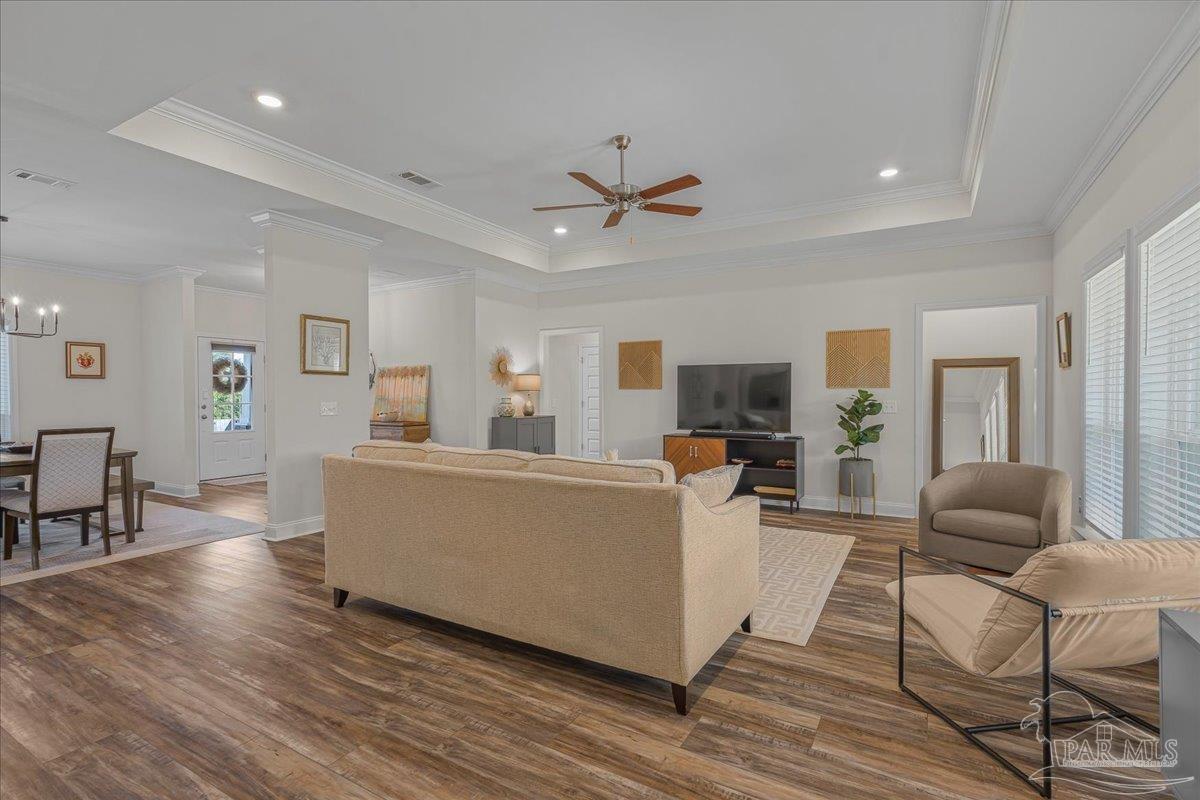 441 Broadleaf Circle Cantonment, FL 32533 - Photo 9 of 42 a living room with furniture and a flat screen tv