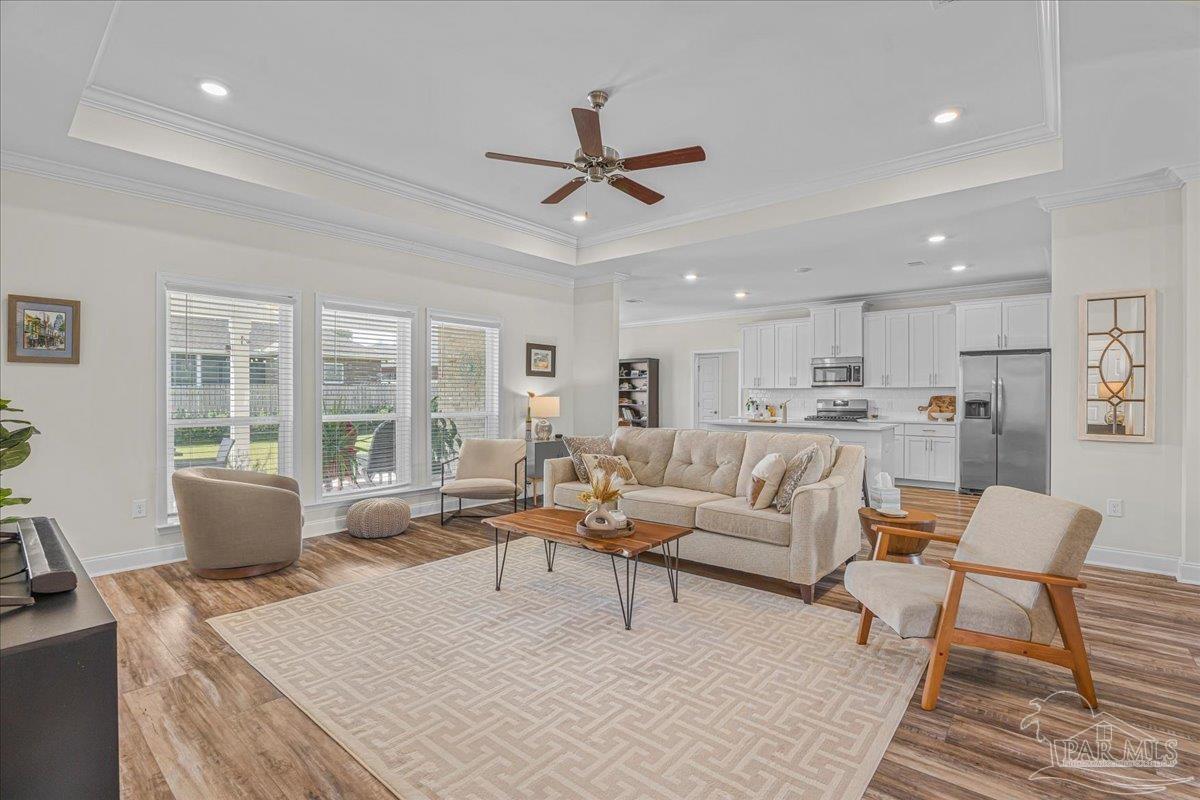 441 Broadleaf Circle Cantonment, FL 32533 - Photo 10 of 42 a living room with furniture and a large window