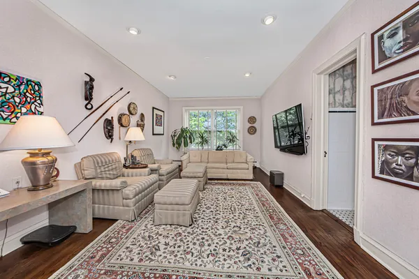 a living room with furniture and a rug