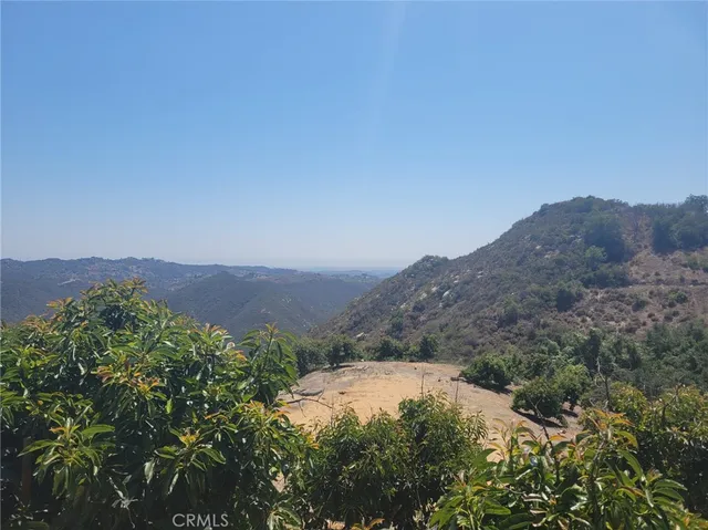 an aerial view of a house with mountain view