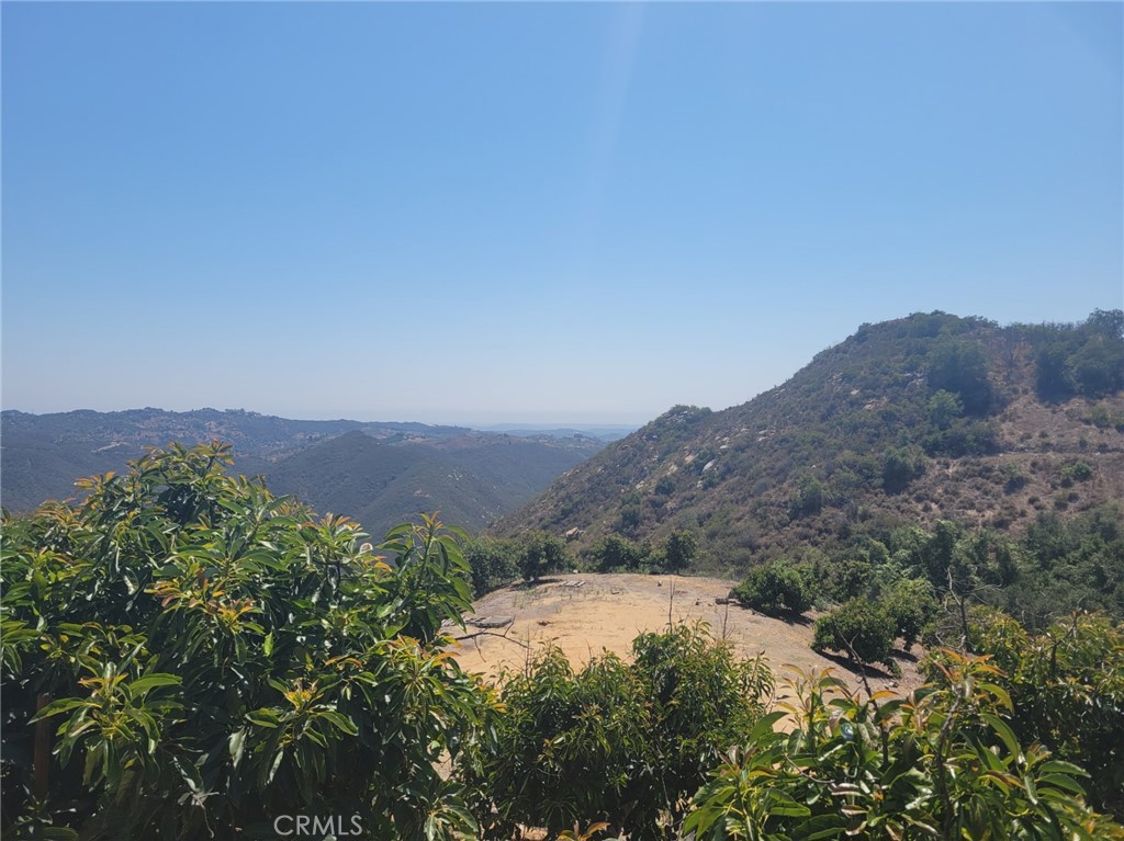 an aerial view of a house with mountain view