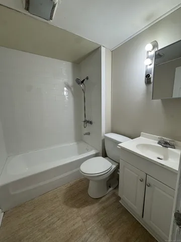 a bathroom with a toilet sink and bathtub