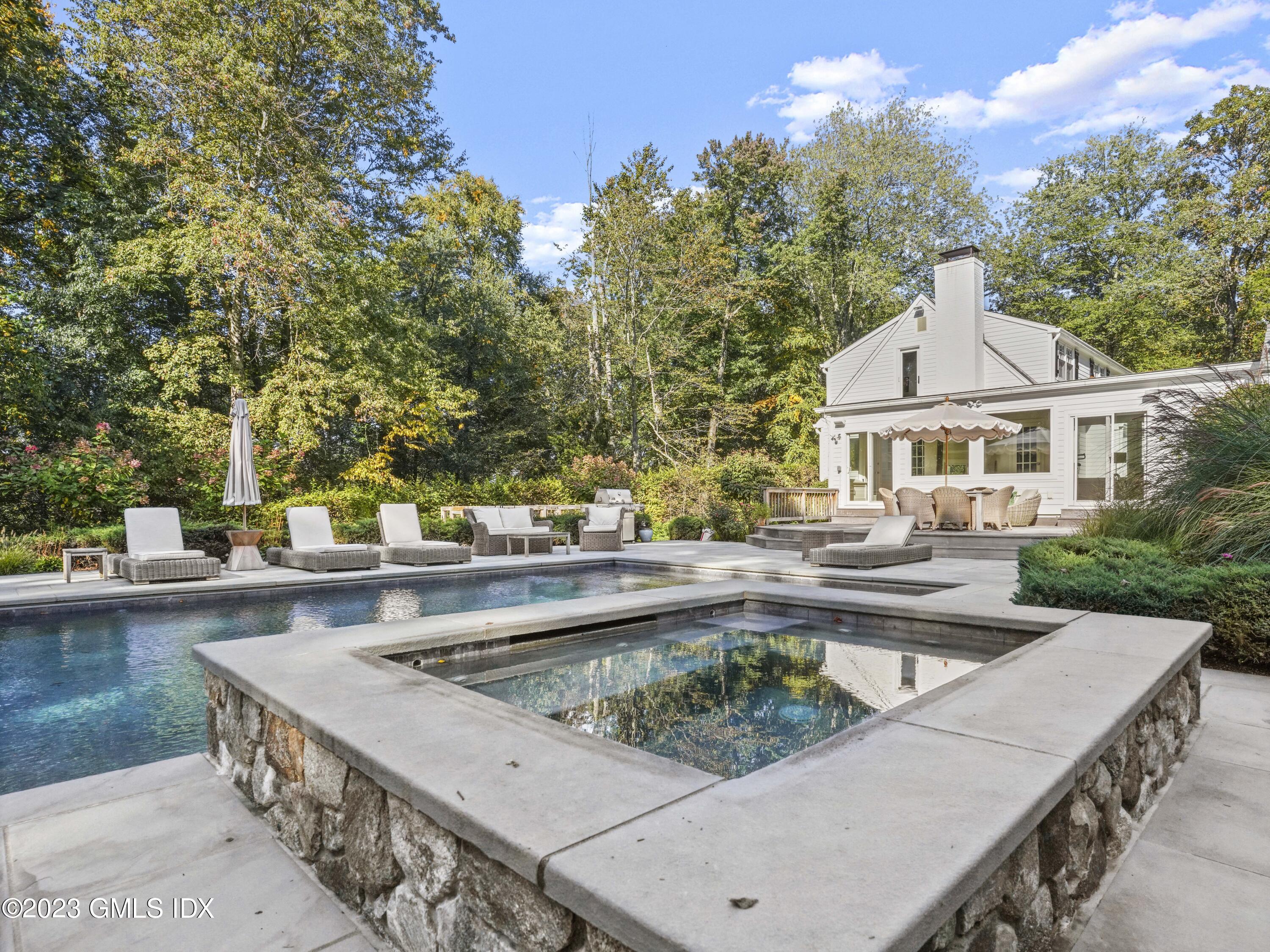 156 Pinewood Road Stamford, CT 06903 - Photo 25 of 28 a view of a house with pool and chairs