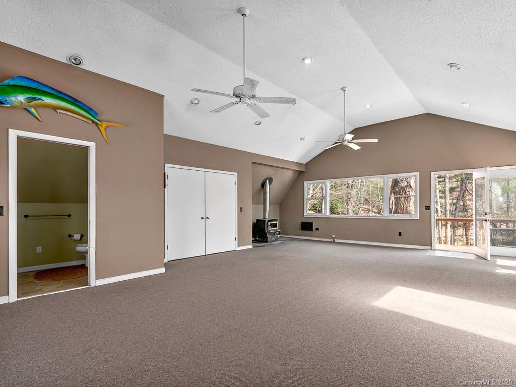 950 Walker Road Waynesville, NC 28786 - Photo 18 of 29 a view of a water heater room with a ceiling fan