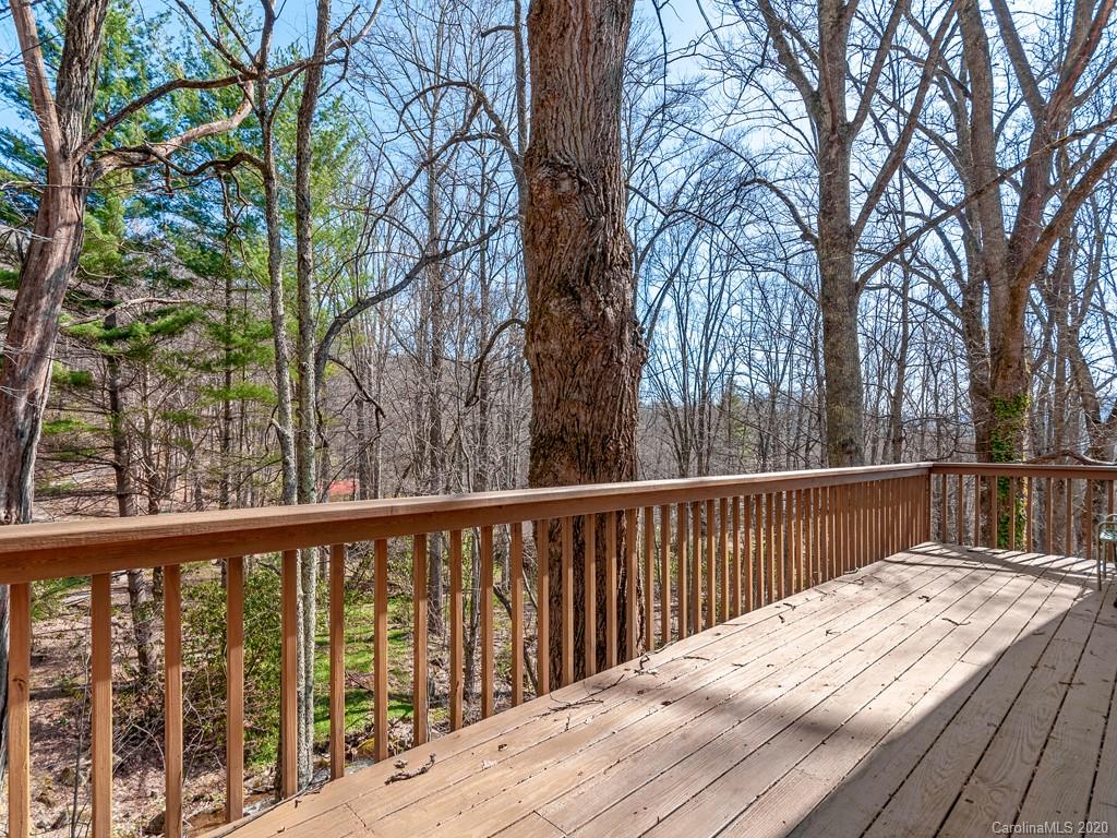 950 Walker Road Waynesville, NC 28786 - Photo 19 of 29 a balcony with wooden floor and fence