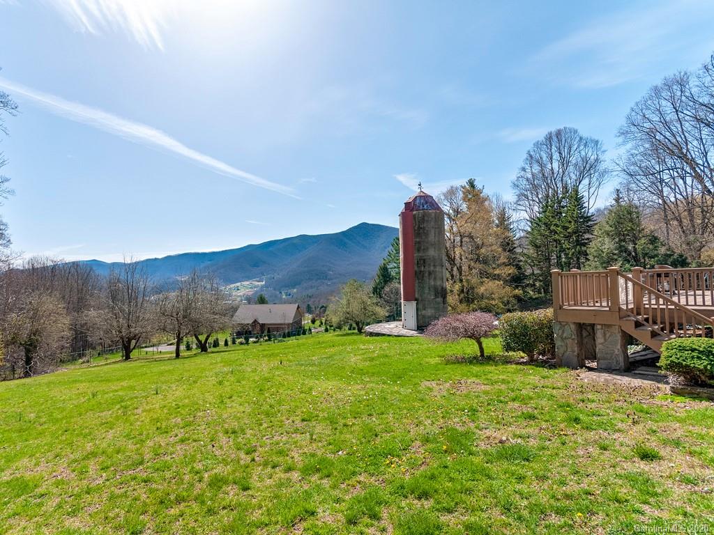 950 Walker Road Waynesville, NC 28786 - Photo 3 of 29 a view of a garden with houses