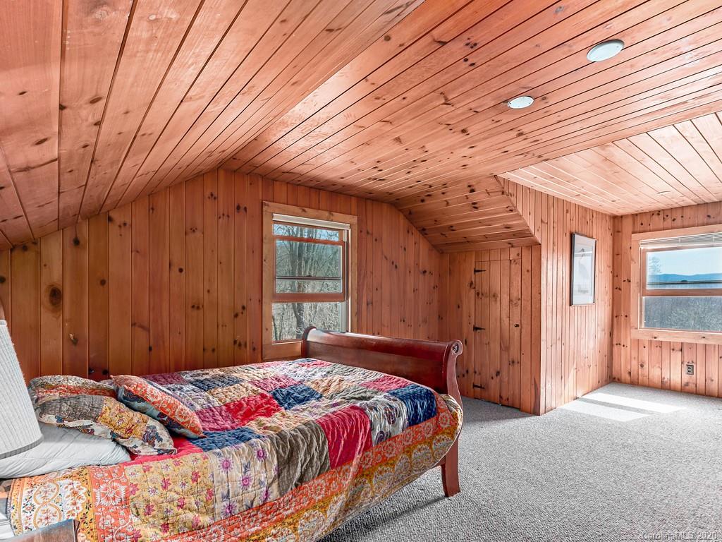 950 Walker Road Waynesville, NC 28786 - Photo 23 of 29 a bedroom with a bed and a window