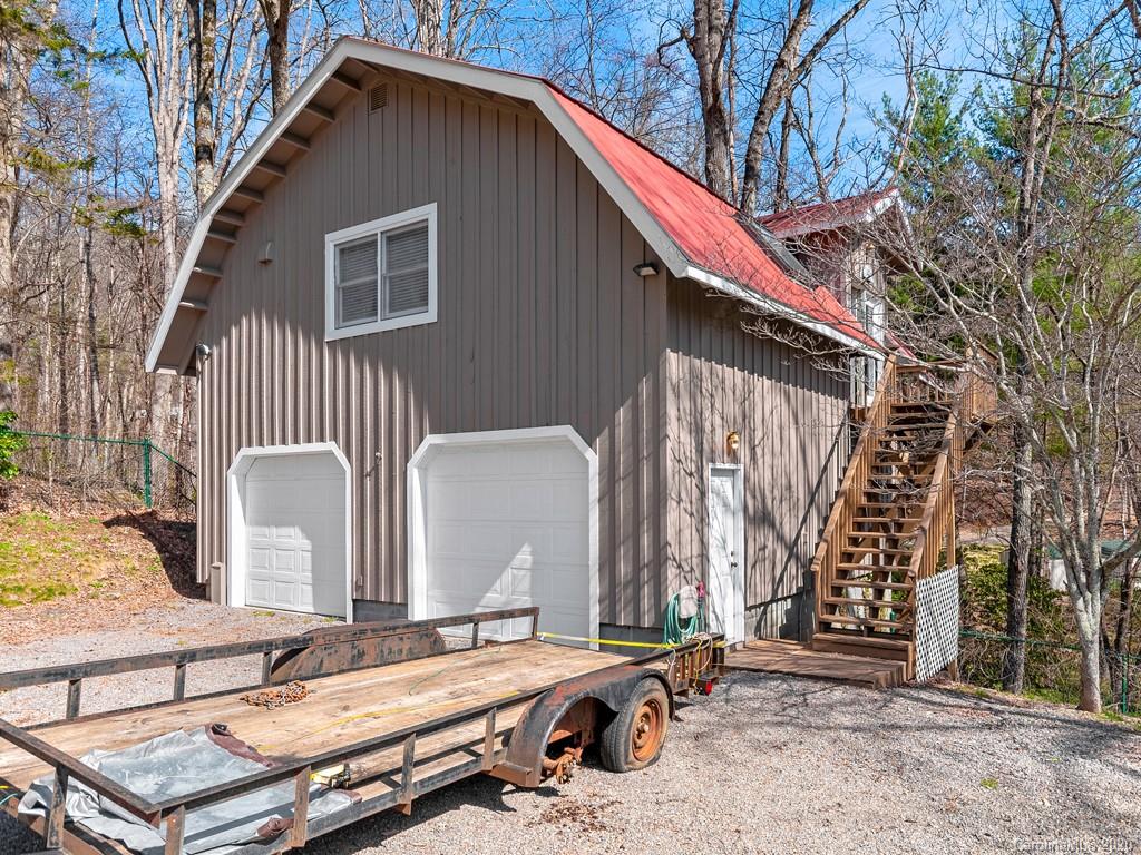 950 Walker Road Waynesville, NC 28786 - Photo 26 of 29 a backyard of a house with barbeque oven and outdoor seating