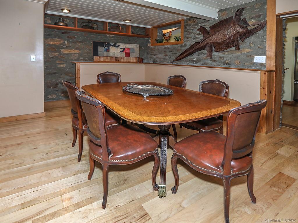950 Walker Road Waynesville, NC 28786 - Photo 5 of 29 a view of a dining room with furniture and wooden floor