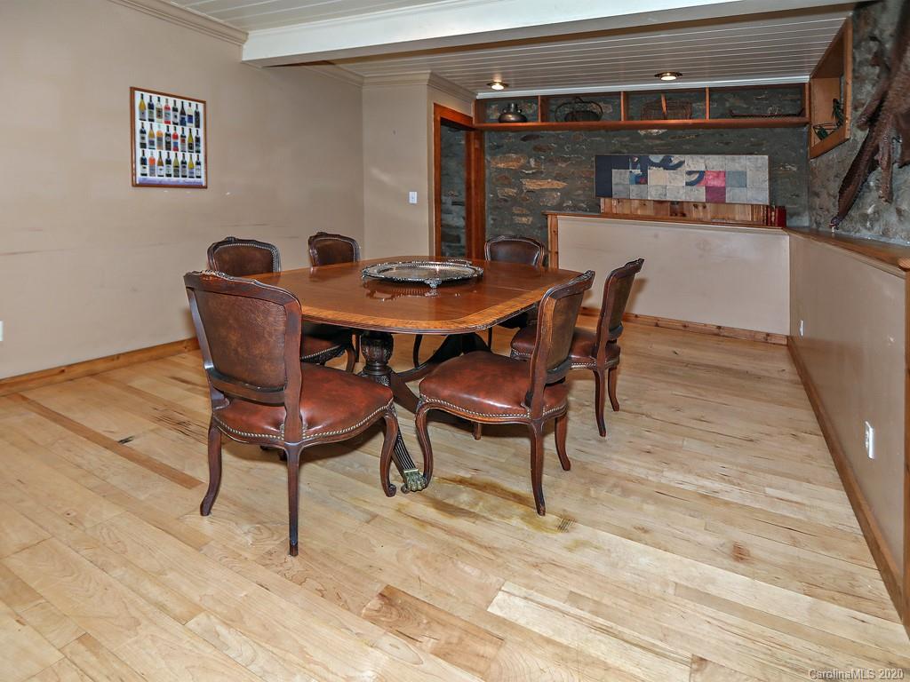 950 Walker Road Waynesville, NC 28786 - Photo 6 of 29 a dining room with furniture and a kitchen view