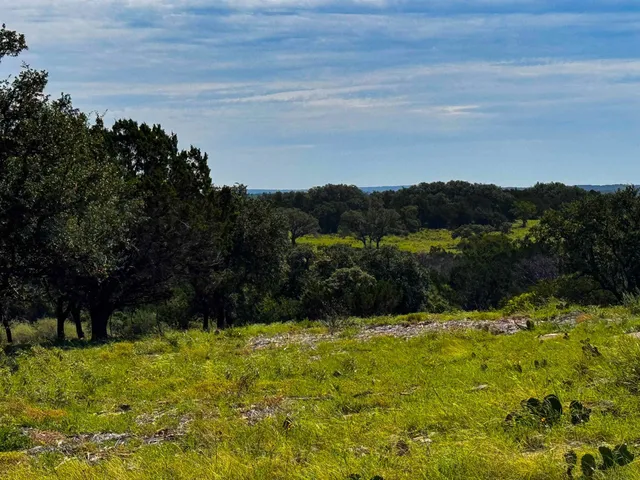 a view of lake with a yard