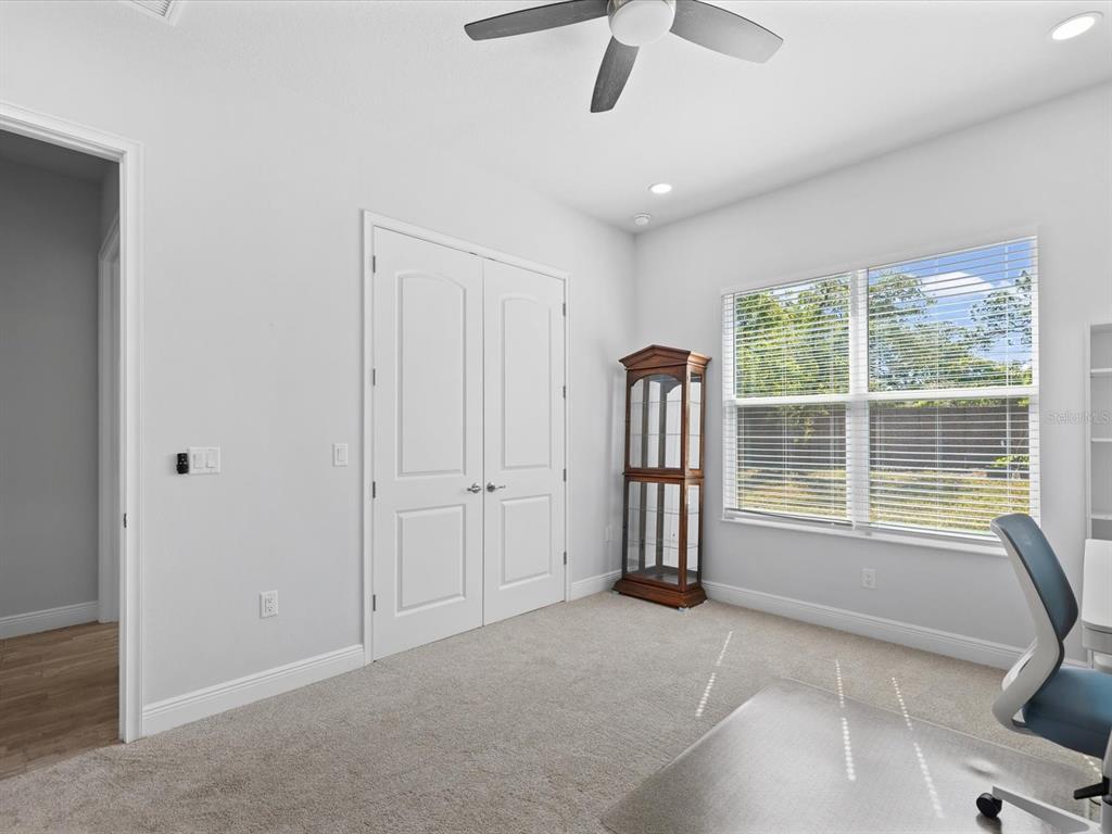 11981 Robina Road Weeki Wachee, FL 34614 - Photo 31 of 93 a view of a livingroom with a ceiling fan and window