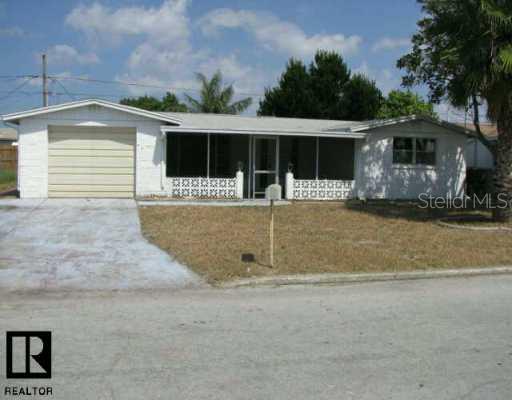 3851 Carioca Road Holiday, FL 34691 - Photo 1 of 1 front view of a house with a yard