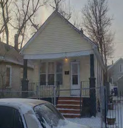 36 West 151st Street Harvey, IL 60426 - Photo 2 of 2 a front view of a house with stairs