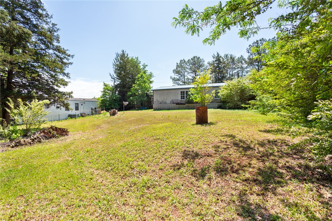 209 Short Cut Road Westminster, SC 29693 - Photo 7 of 27 Expansive outdoor space offering lush greenery and open-air possibilities.