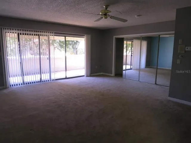 a view of empty room with windows