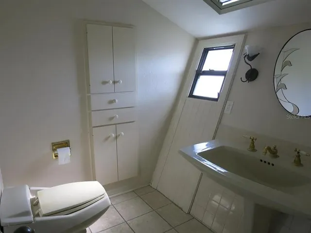 a bathroom with a sink and toilet