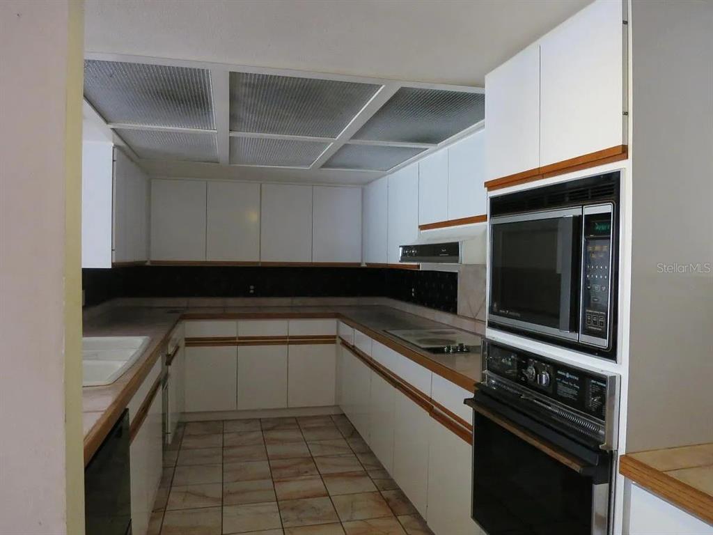 17 Casarena Court Winter Haven, FL 33881 - Photo 10 of 13 a kitchen with a sink and stainless steel appliances