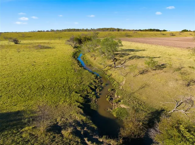 a view of a lake with a yard