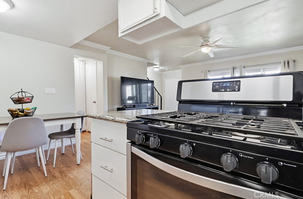 13470 Meyer Road, Unit 22 Whittier, CA 90605 - Photo 18 of 50 a kitchen with a stove and a refrigerator
