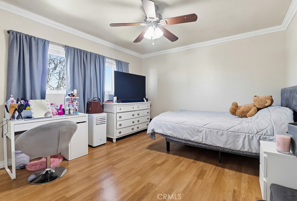 13470 Meyer Road, Unit 22 Whittier, CA 90605 - Photo 23 of 50 a bedroom with furniture and flat screen tv
