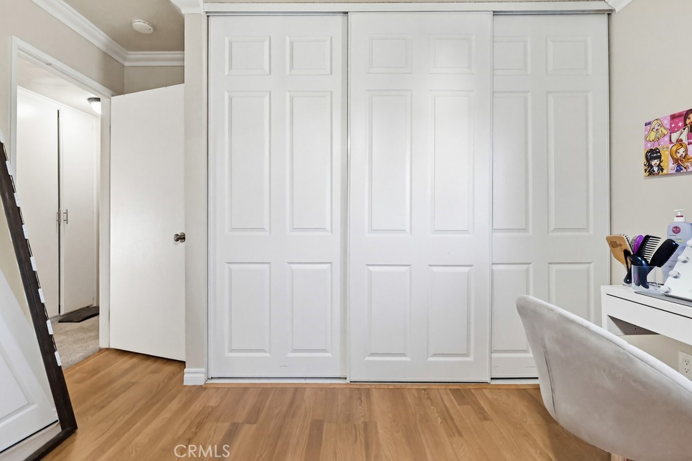 13470 Meyer Road, Unit 22 Whittier, CA 90605 - Photo 26 of 50 a view of a room with wooden floor and cabinet