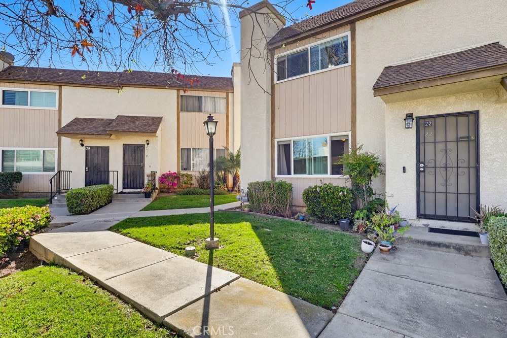 13470 Meyer Road, Unit 22 Whittier, CA 90605 - Photo 4 of 50 a view of a house with backyard and porch