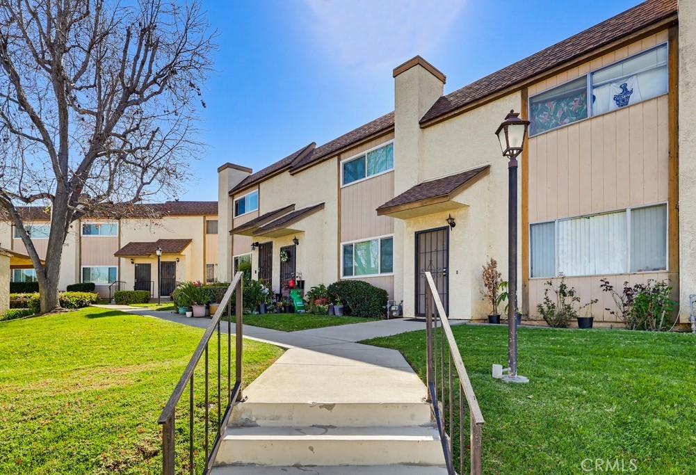 13470 Meyer Road, Unit 22 Whittier, CA 90605 - Photo 42 of 50 a front view of a house with a yard